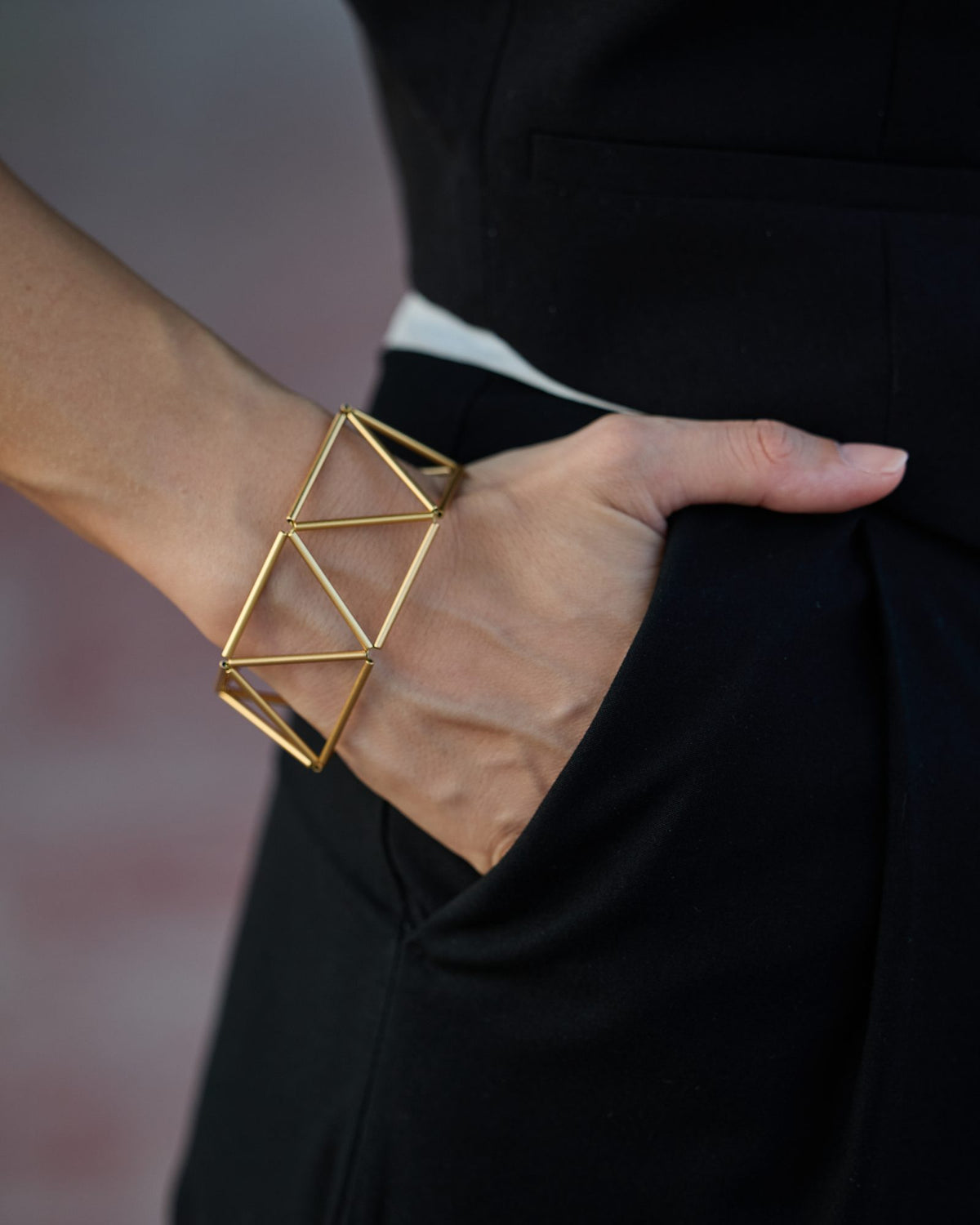 Greca Gold bracelet in gold-plated brass, worn, close-up on the wrist