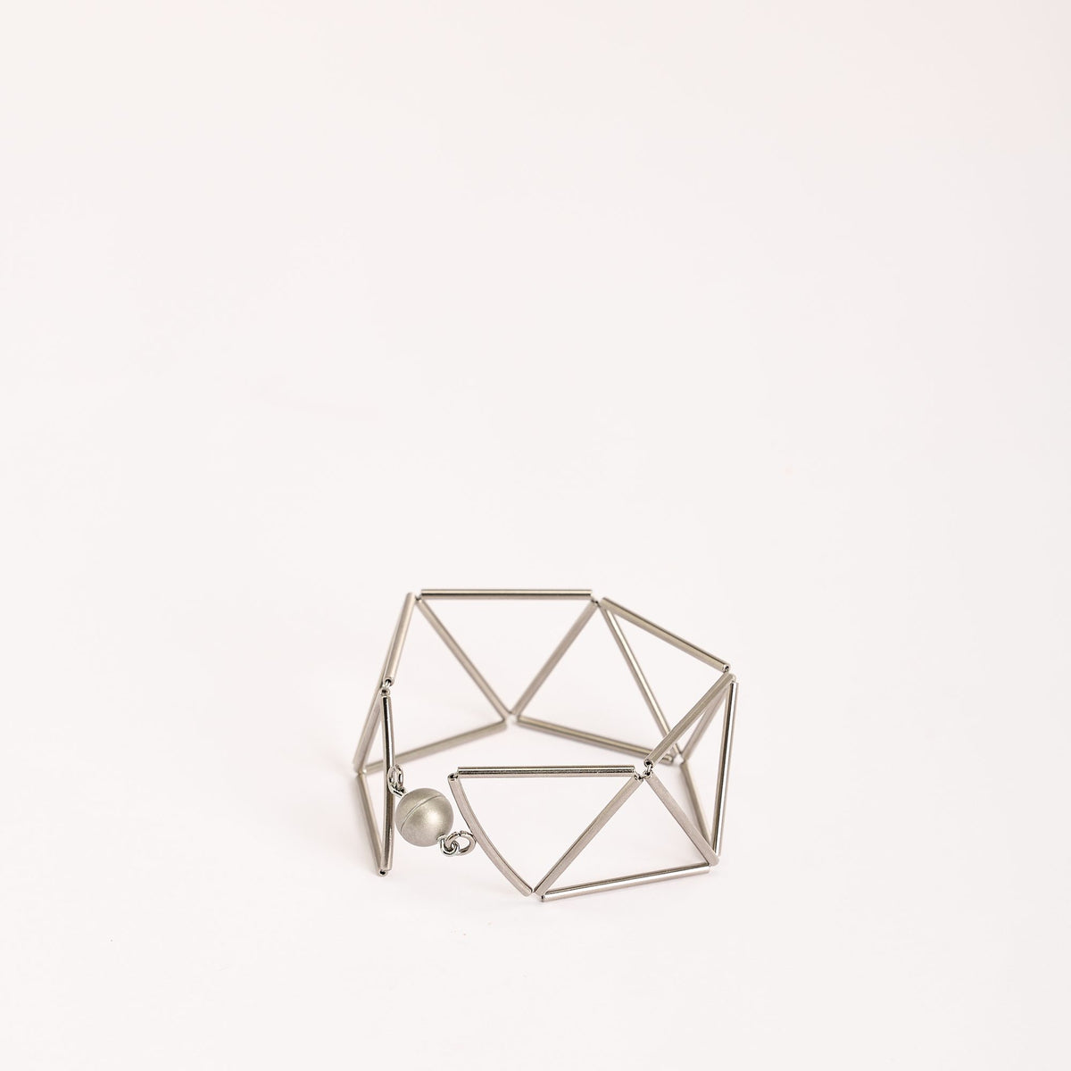 Greca Rhodium bracelet in rhodium-plated brass, close-up detail on a white background