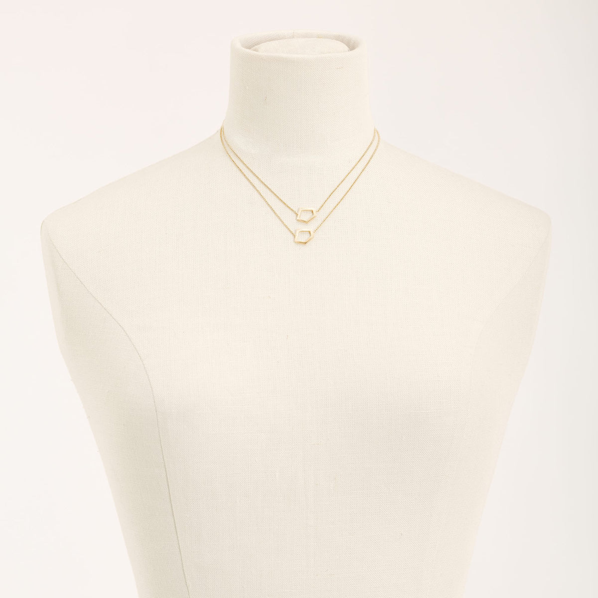 I'mperfect Gold necklace in 925 sterling silver, on a light background