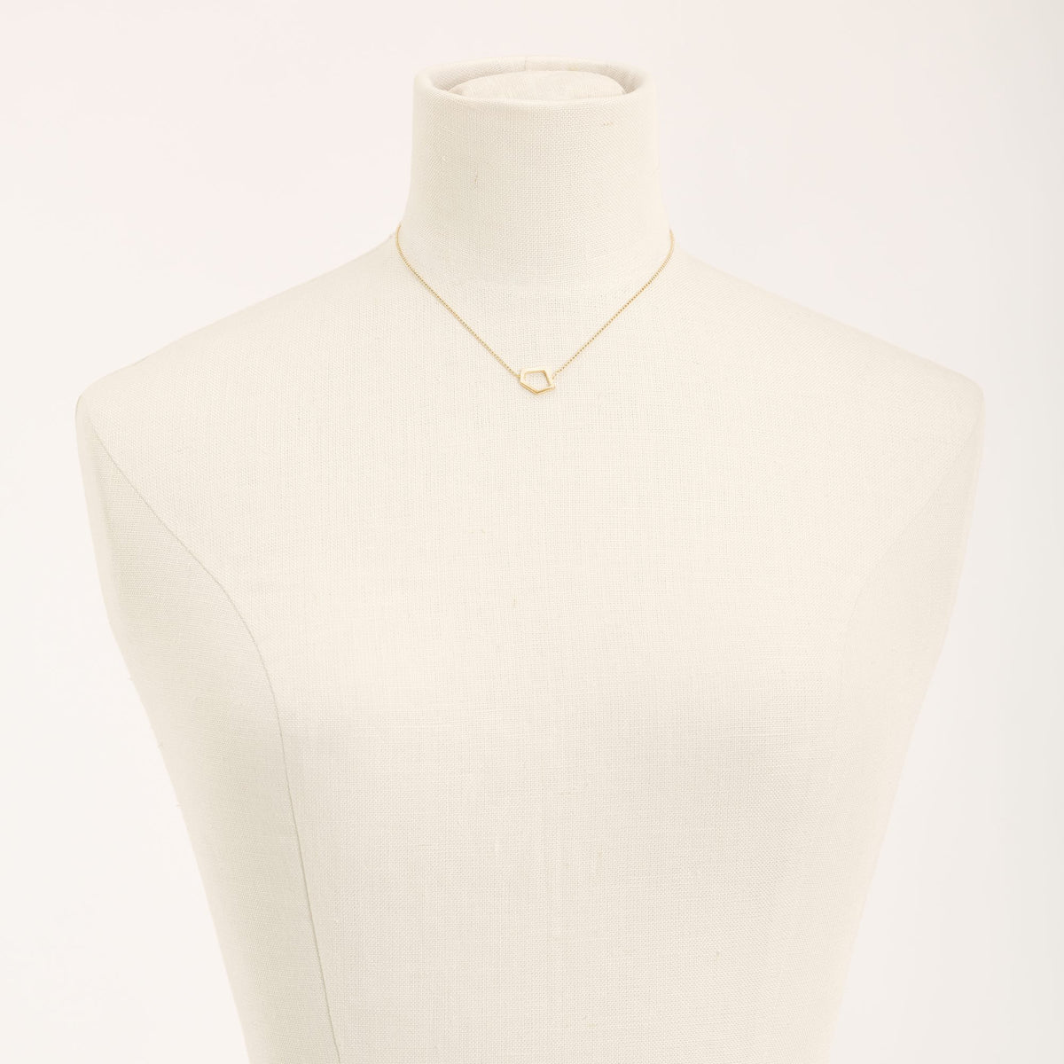 I'mperfect Gold necklace in 925 sterling silver, on a light background