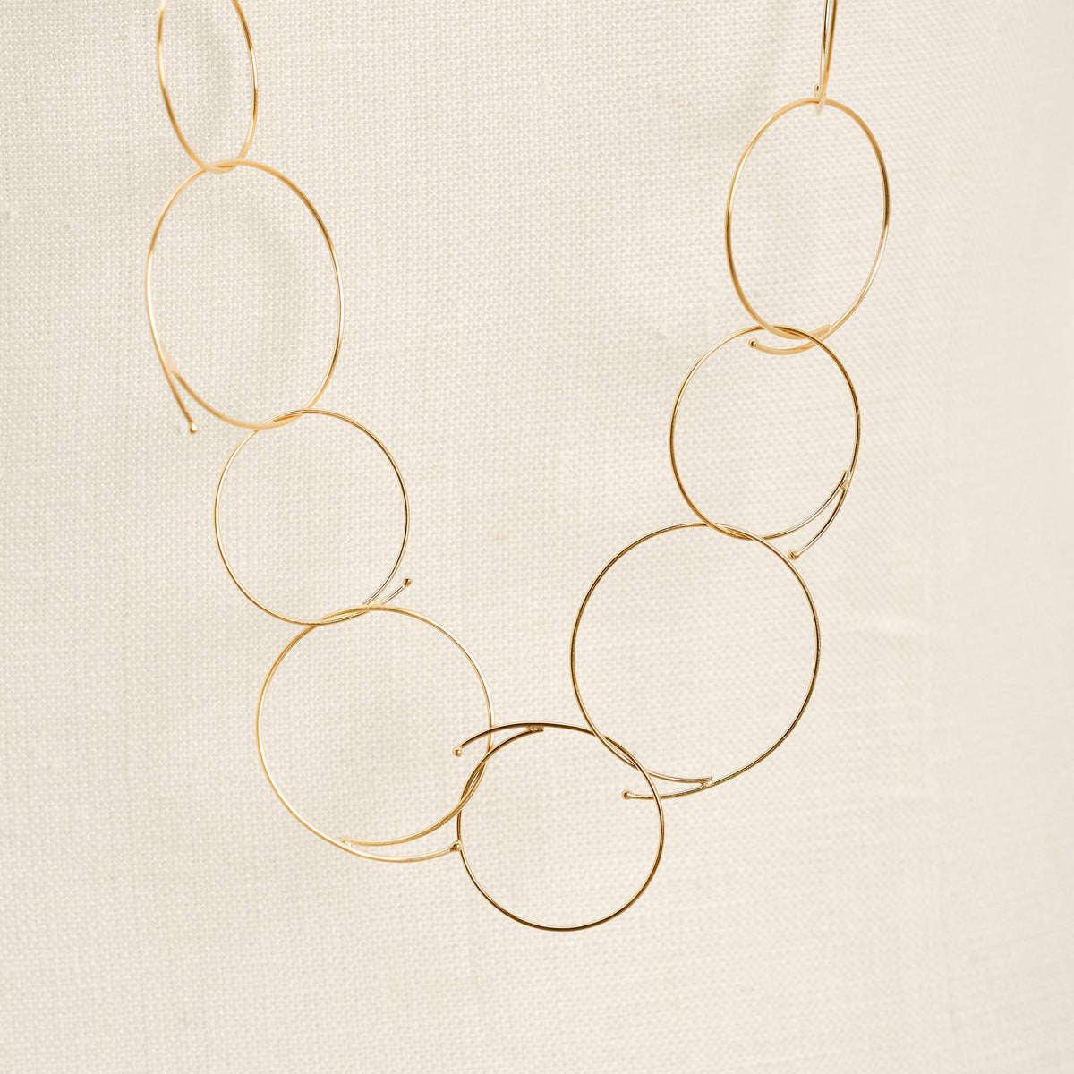 Junction Gold necklace in 925 sterling silver, close-up detail on a light background