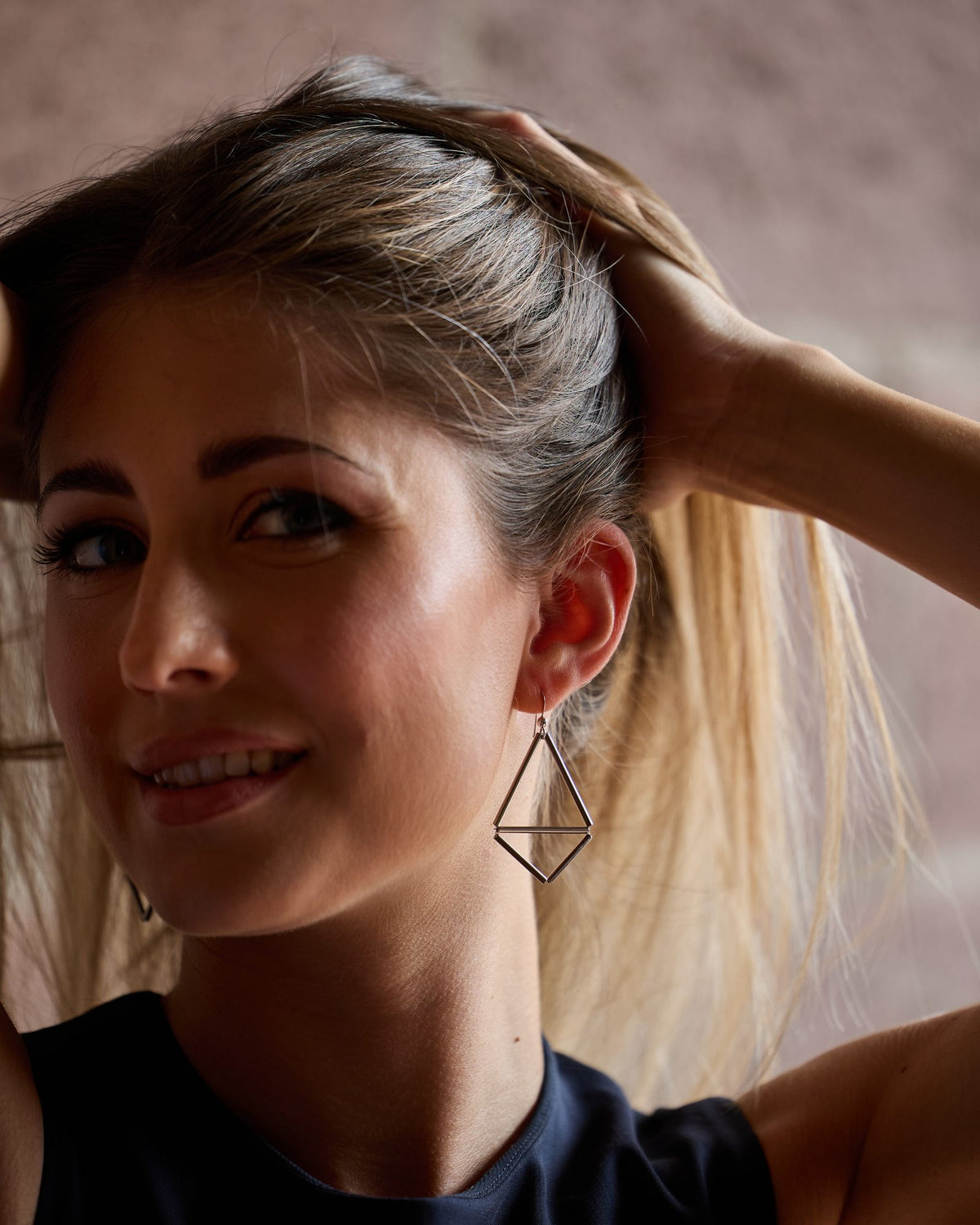 Kite 1 Rhodium earrings in rhodium-plated brass and rhodium-plated silver, worn, close-up on the ear