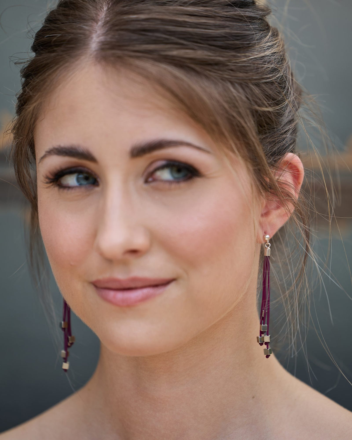 Woman wearing Luce Earrings