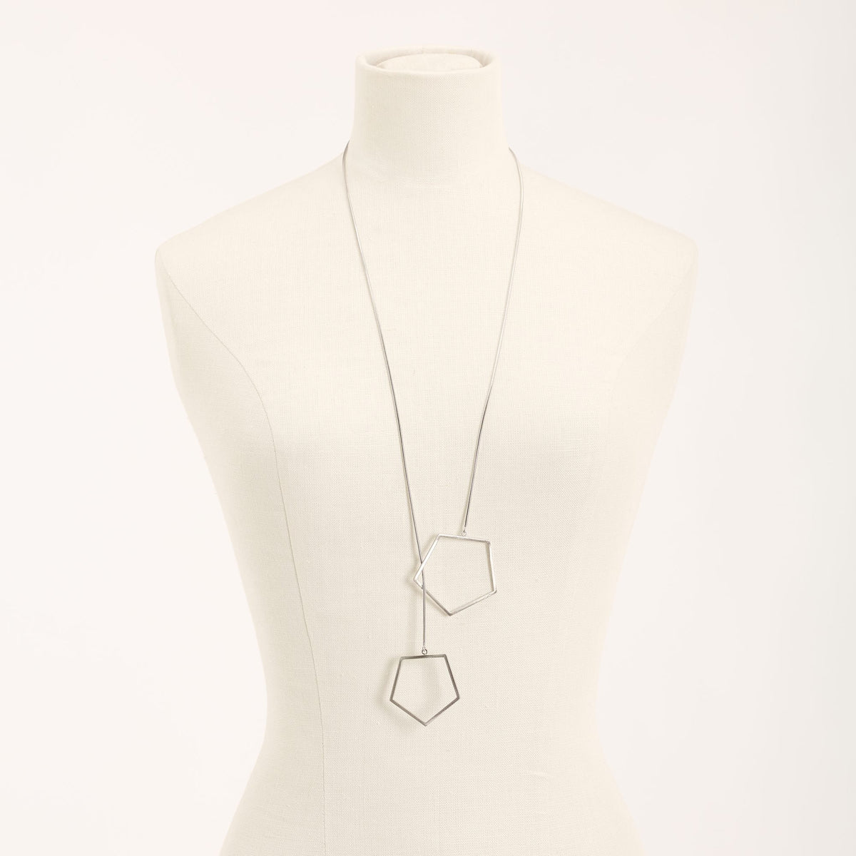 Sisters Rhodium necklace in 925 sterling silver, on a light background