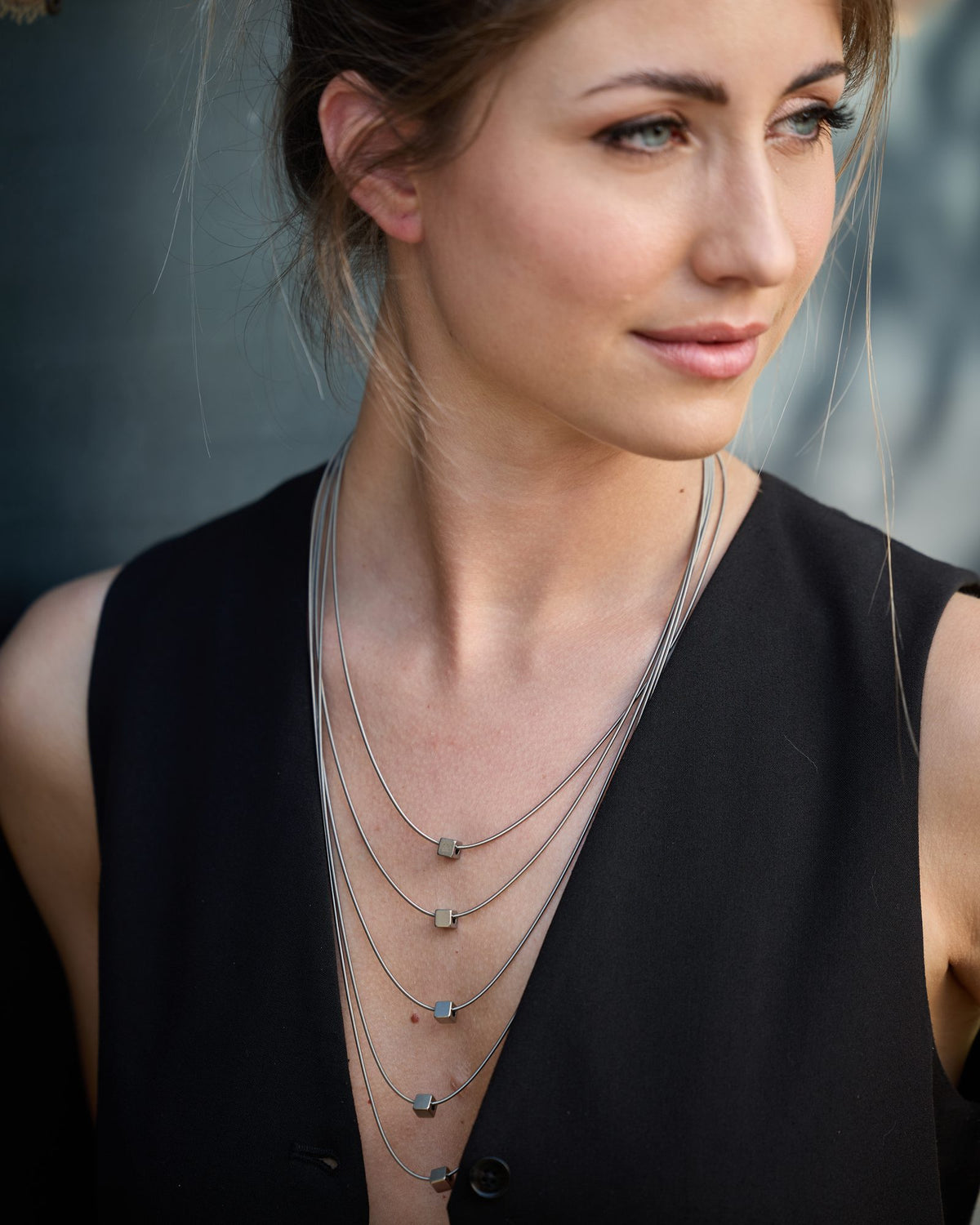 Wave Short necklace in steel, worn, close-up detail