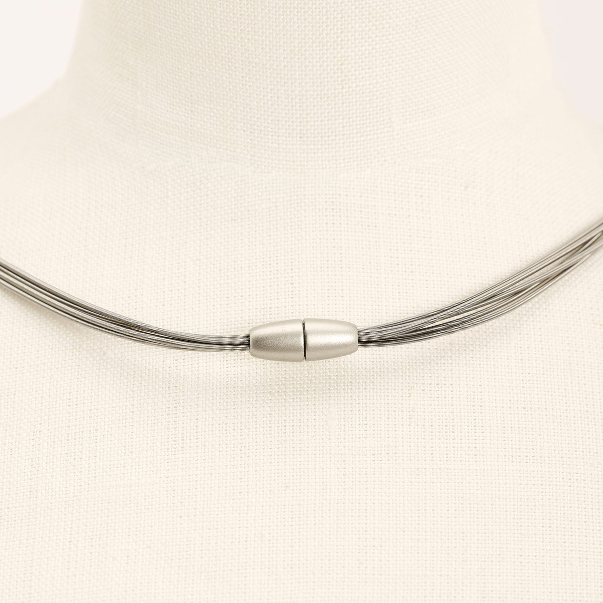 Wave Short necklace in steel, on a light background