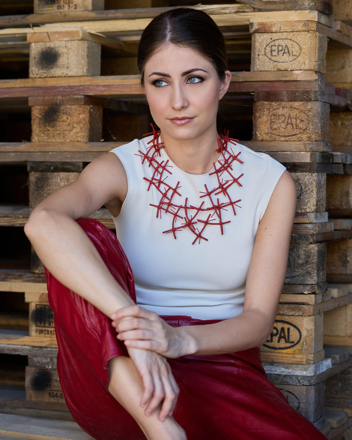 Woman wearing X Necklace