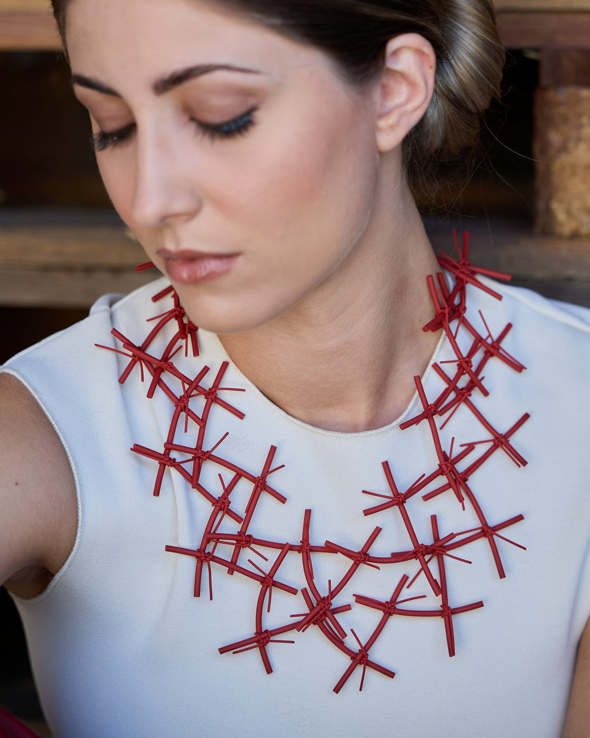 Woman wearing X Necklace