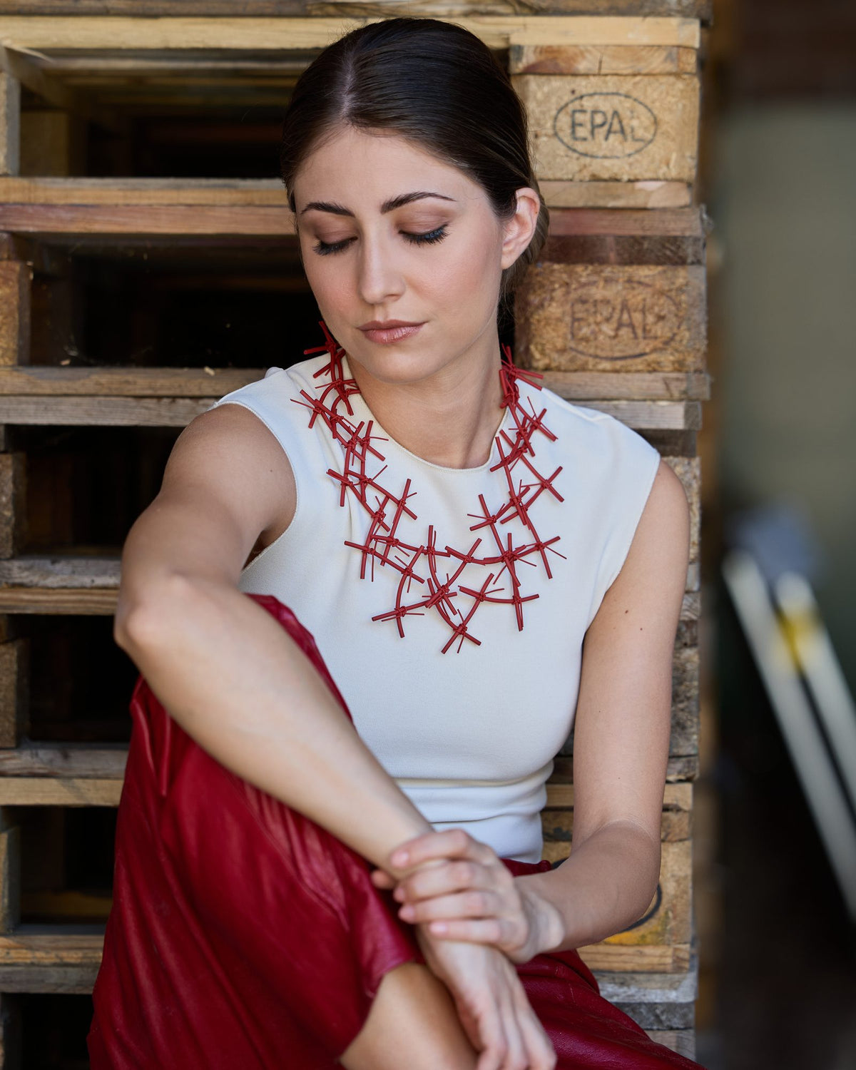 Woman wearing X Necklace