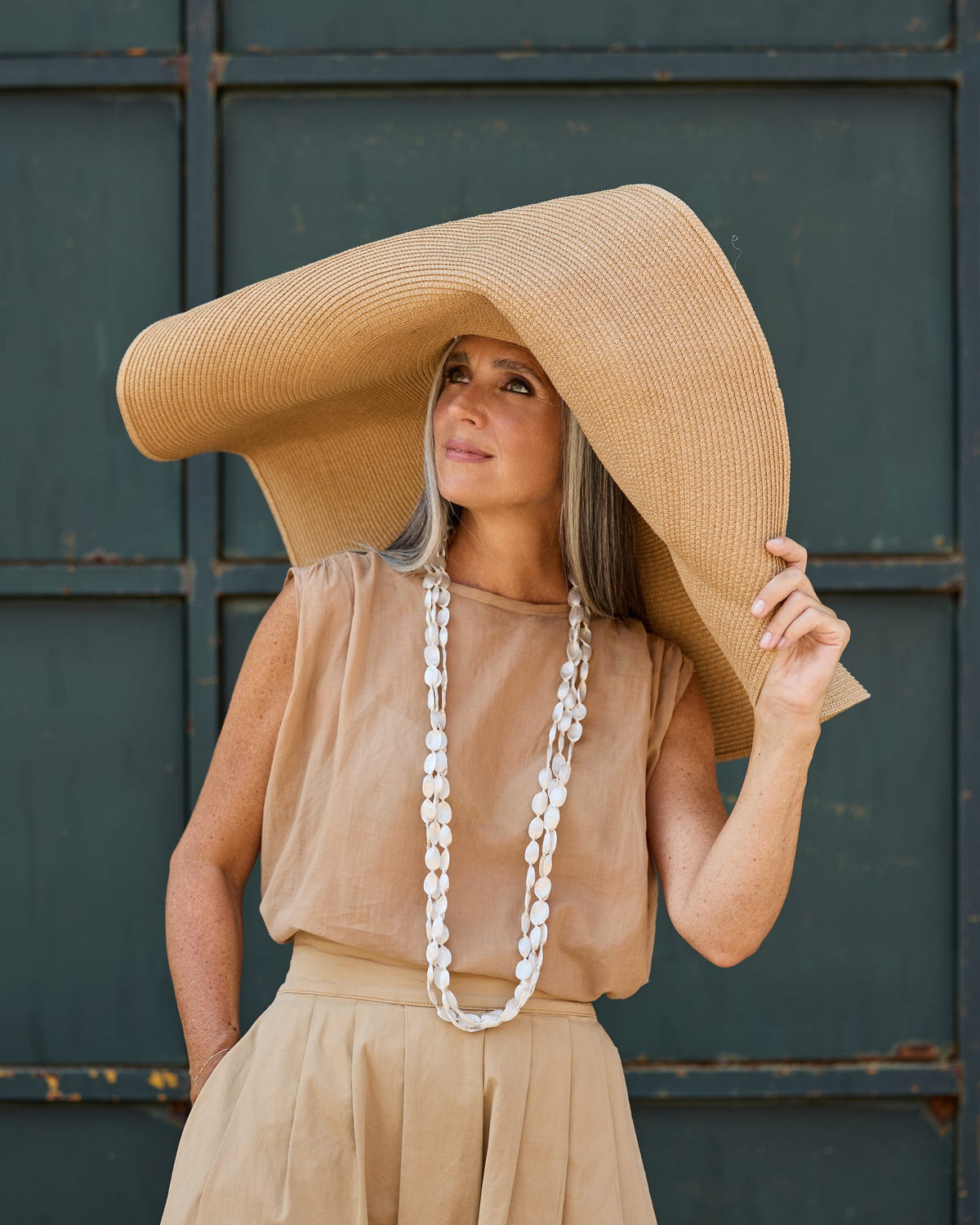 Woman wearing Caurì Long Necklace