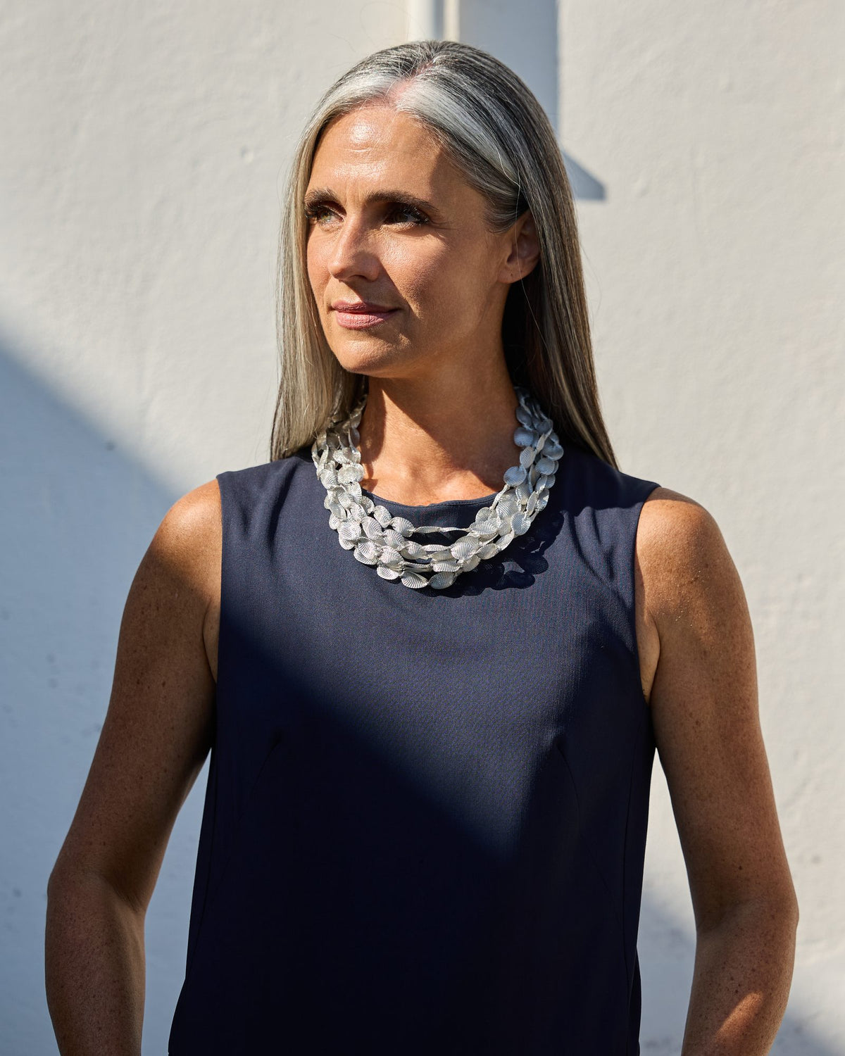 Woman wearing Caurì Short Necklace
