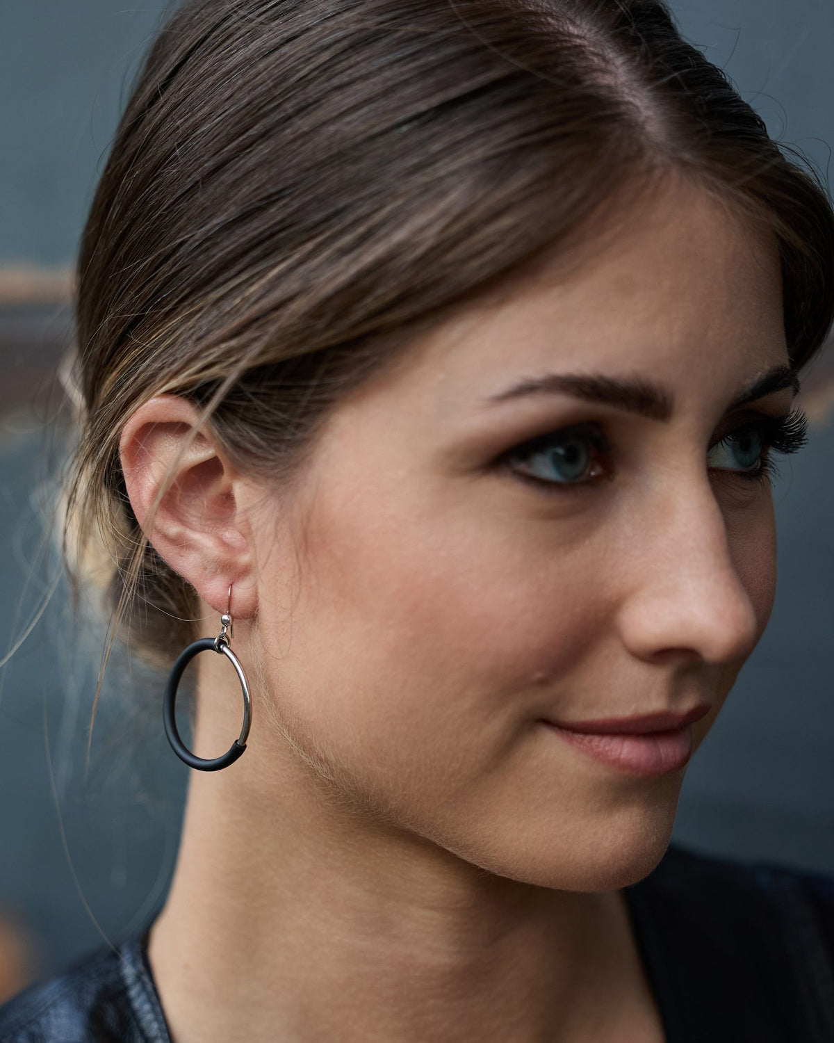 Woman wearing Eclissi Rhodium Earrings