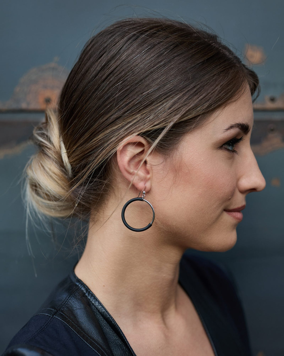 Woman wearing Eclissi Rhodium Earrings