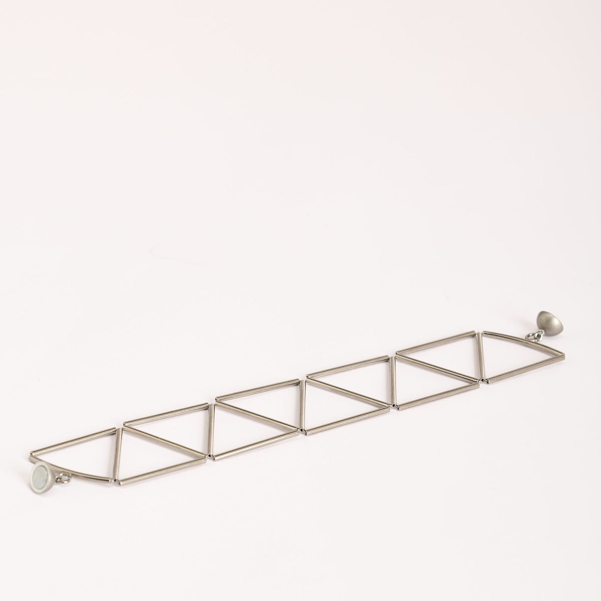 Greca Rhodium bracelet in rhodium-plated brass, on a white background
