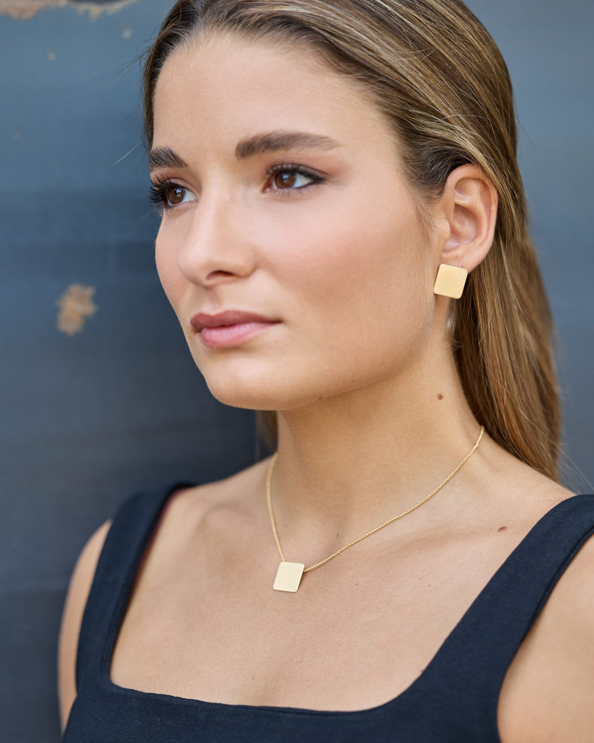 QB Gold earrings in 925 sterling silver, worn