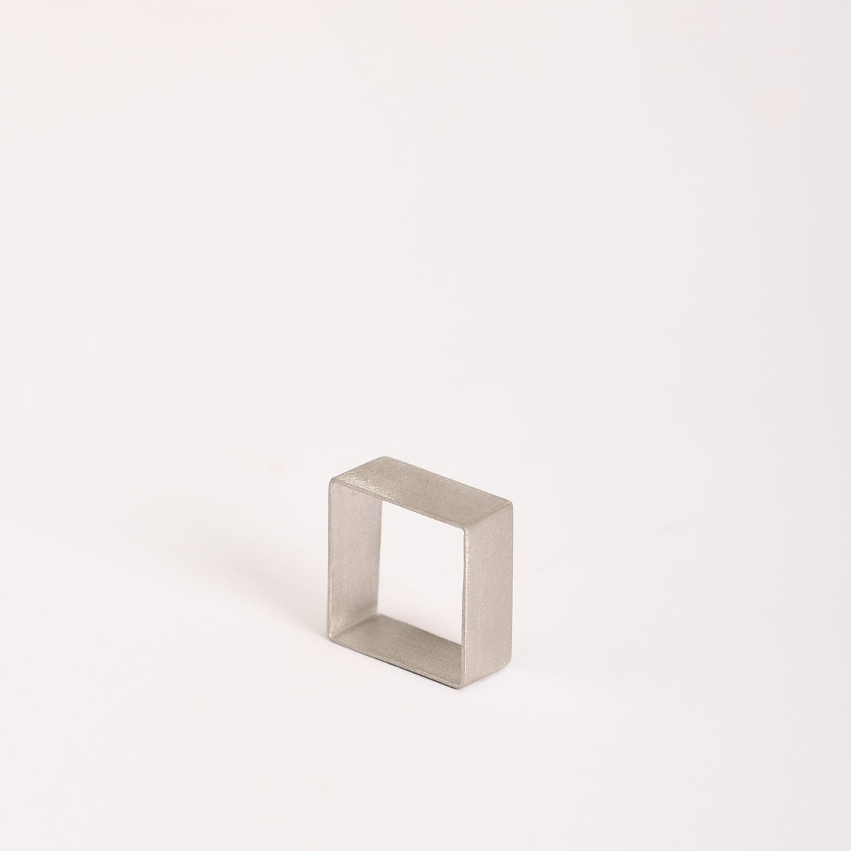 QB Mini Rhodium ring in 925 sterling silver, on a white background