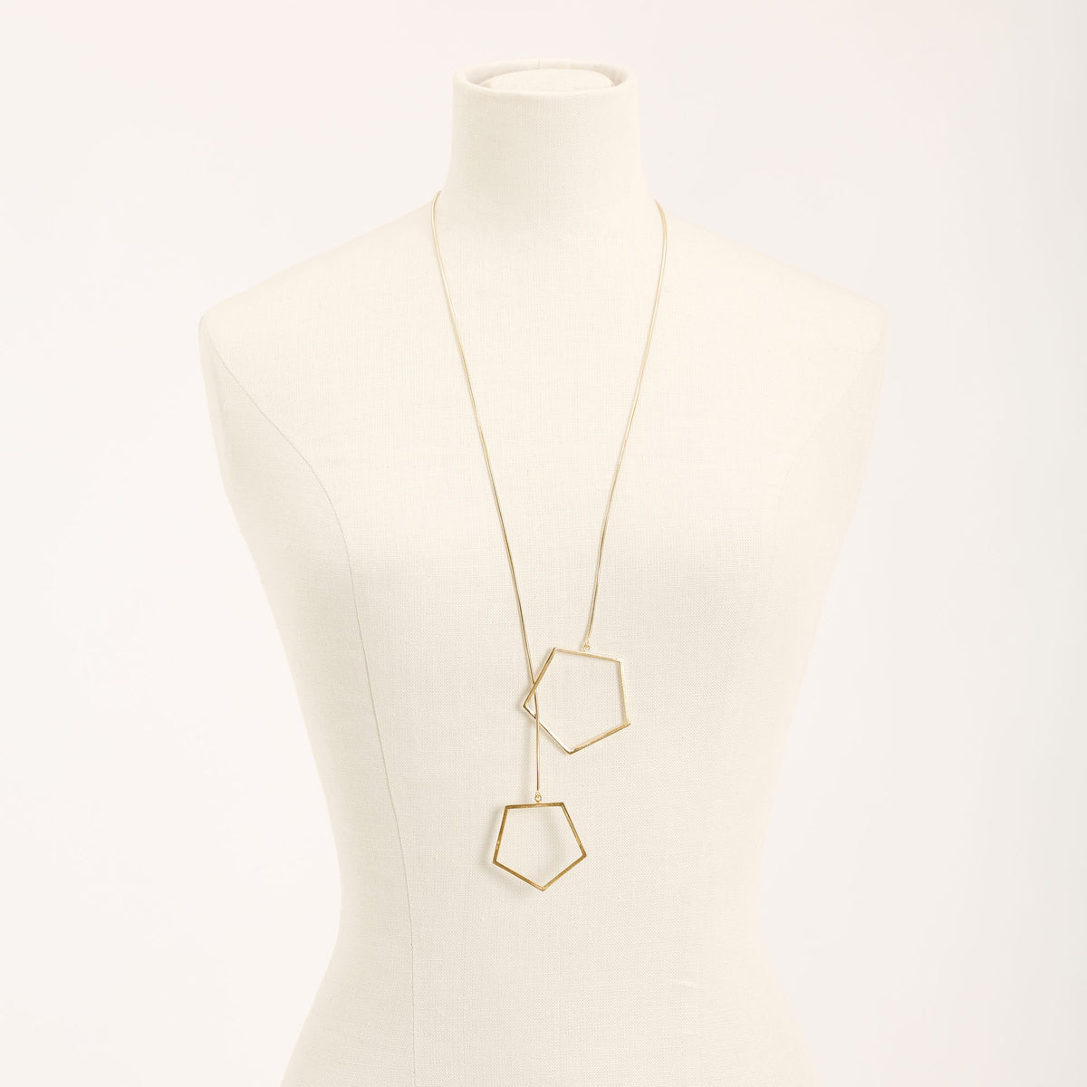 Sisters Gold necklace in 925 sterling silver, on a light background