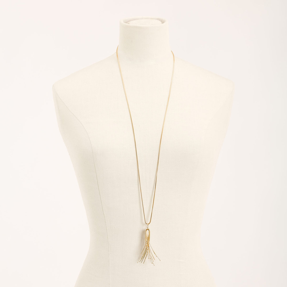 Vento Long Gold necklace in 925 sterling silver, on a light background